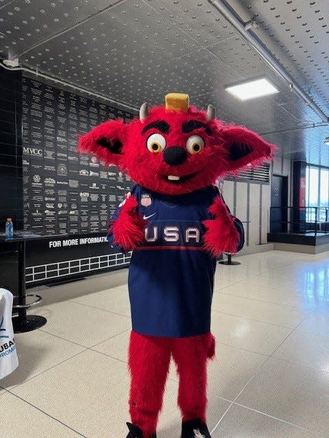 Utica Comets (the AHL affiliate of the New Jersey Devils) mascot Naudie poses in the hallway at the Adirondack Bank Center on day one of the IIHF tournament.