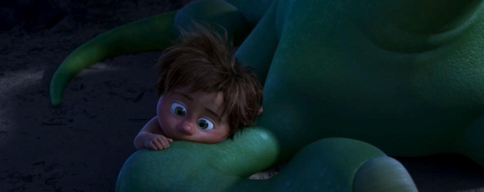 Spot comforts Arlo in <i>The Good Dinosaur</i> (Disney)