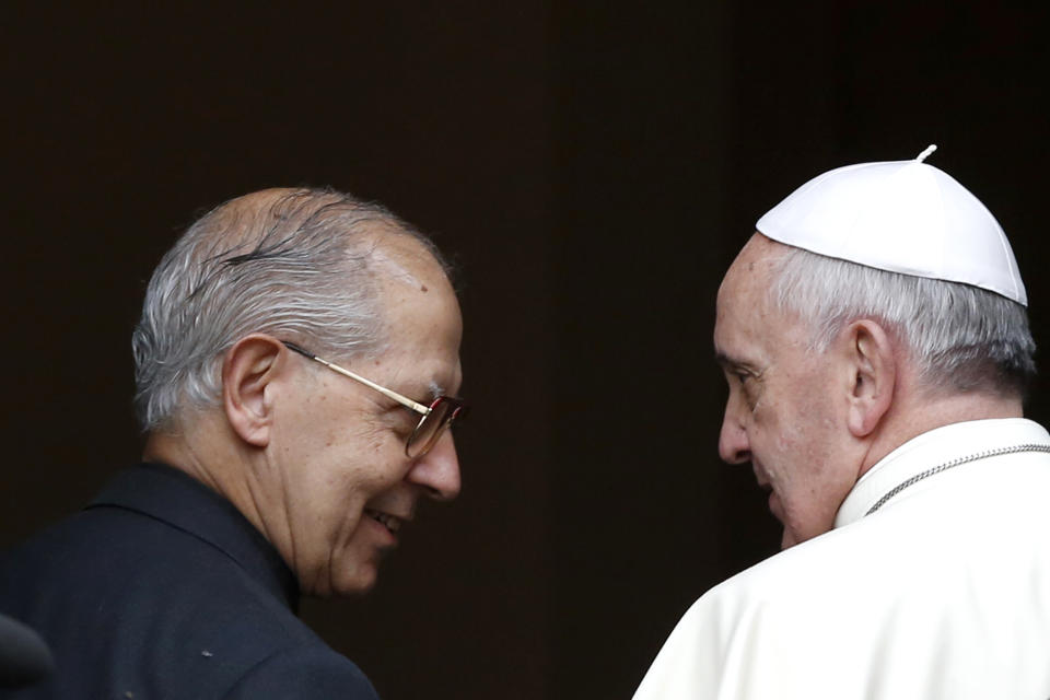 Pope Francis, right, talks with Jesuit leader Rev. Adolfo Nicolas upon his arrival at the Jesus' Church to celebrate a mass with the Jesuits, on the occasion of the order's titular feast, in Rome, Friday, Jan. 3, 2014. (AP Photo/Riccardo De Luca)