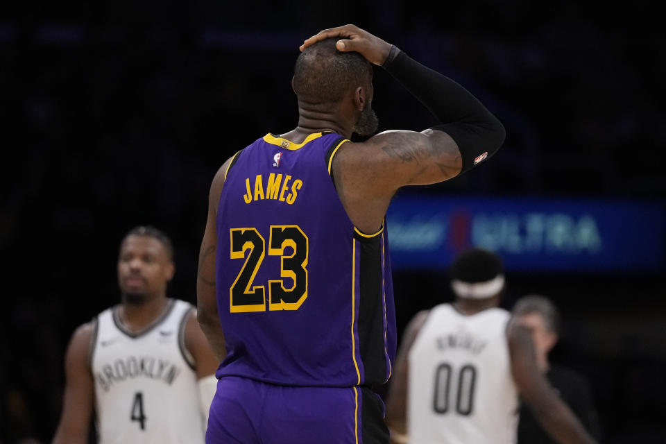 Los Angeles Lakers forward LeBron James (23) reacts after being called for a flagrant foul during the second half of an NBA basketball game against the Brooklyn Nets in Los Angeles, Friday, Jan. 19, 2024. (AP Photo/Ashley Landis)
