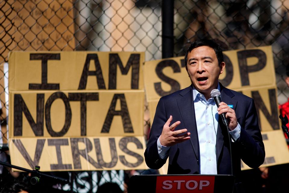 Democratic mayoral candidate Andrew Yang speaks to people as they take part in a rally against hate and racism at Columbus Park in Chinatown, on Sunday, March 21, 2021, in New York. 