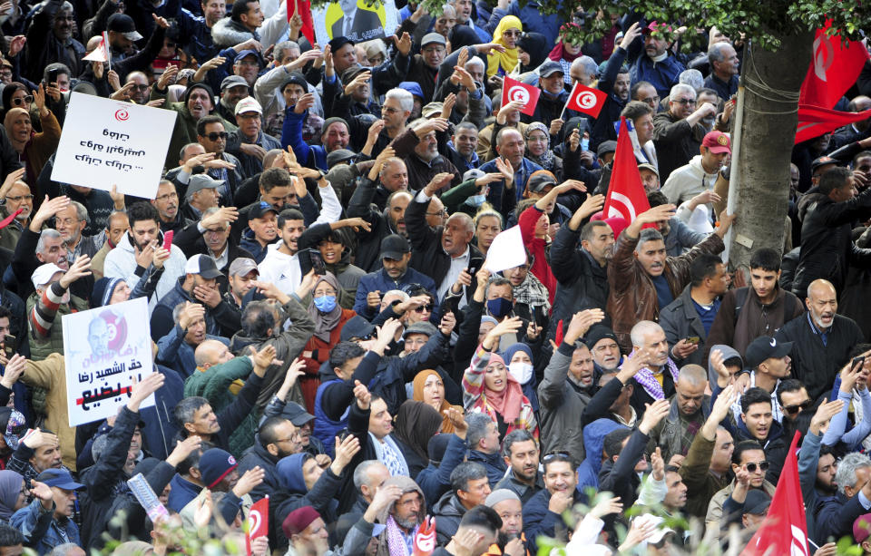 Tunisians gather during a protest against Tunisian President Kais Saied in downtown Tunis, Tunisia, Saturday Jan. 14, 2023. Tunisians mark 12 years since Tunisian protesters unleashed Arab Spring uprisings around the region. The protest comes after disastrous parliamentary elections last month in which just 11% of voters cast ballots. It also comes as the country is going through a major economic crisis, with inflation and joblessness on the rise. (AP Photo/Hassene Dridi)