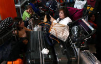 People wait with their luggage at Heathrow Terminal 5 in London, Britain May 27, 2017. REUTERS/Neil Hall