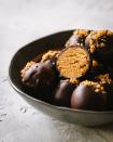 <p>All the flavors of a pumpkin pie in one single bite-sized treat. Oh—and it’s covered in chocolate! </p><p><strong>Get the recipe at <a href="https://lepetiteats.com/pumpkin-pie-truffles/" rel="nofollow noopener" target="_blank" data-ylk="slk:Le Petit Eats;elm:context_link;itc:0;sec:content-canvas" class="link ">Le Petit Eats</a>.</strong></p>