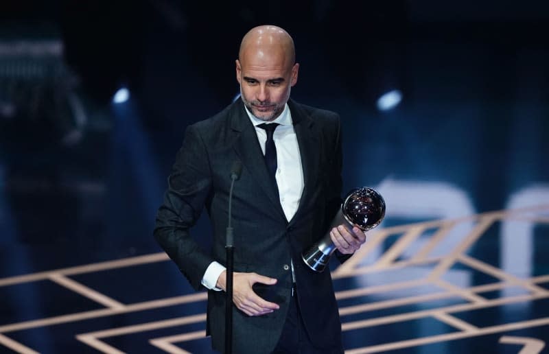 Manchester City manager Pep Guardiola speaks after receiving the award for The Best FIFA Men's Coach on stage during The Best FIFA Football Awards at the Eventim Apollo. John Walton/PA Wire/dpa