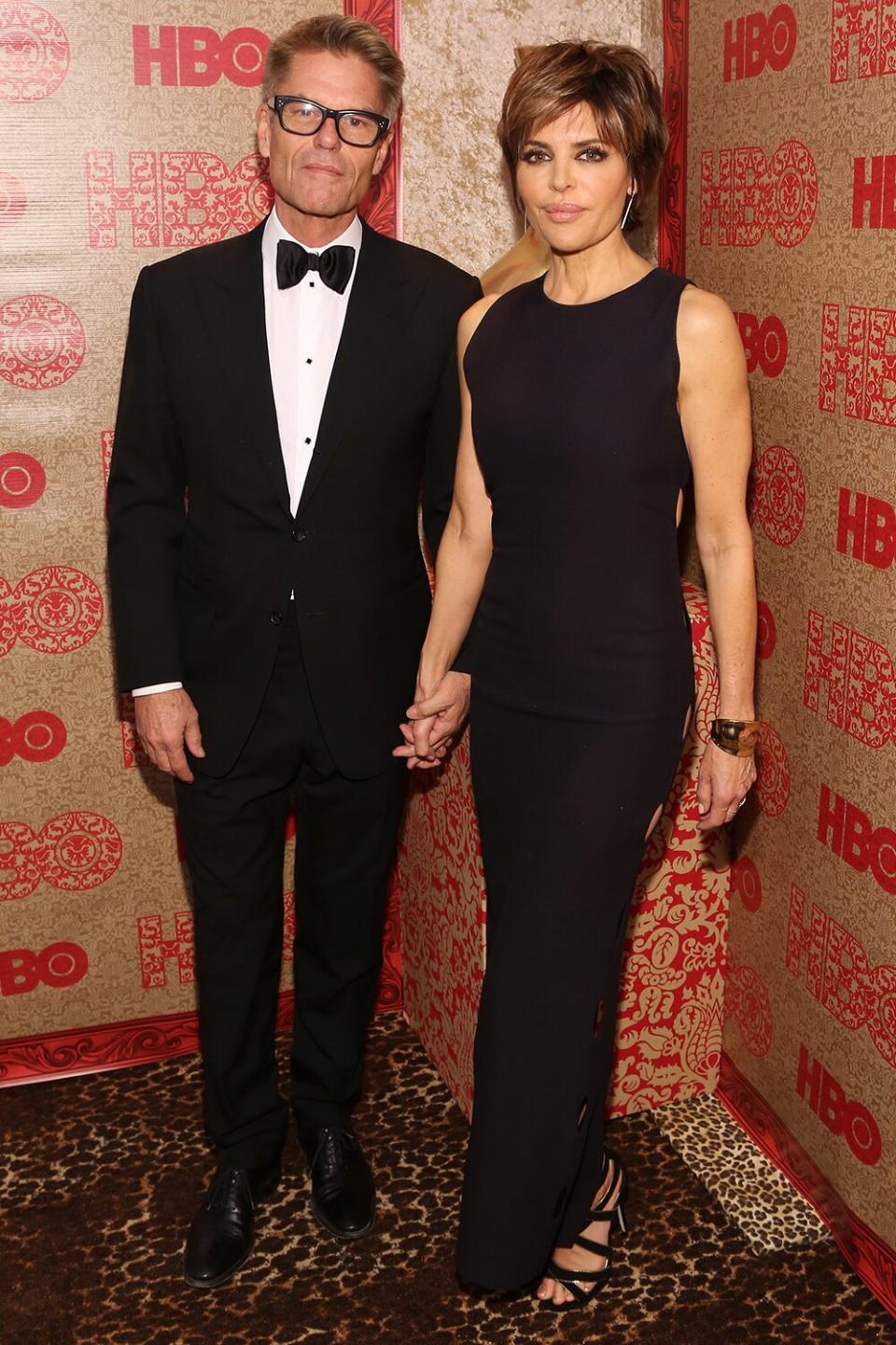 Actor Harry Hamilin (L) and actress Lisa Rinna attend HBO's Official Golden Globe Awards After Party at The Beverly Hilton Hotel on January 12, 2014 in Beverly Hills, California