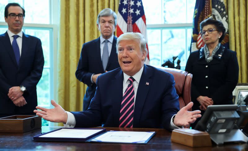 U.S. President Trump participates in coronavirus relief bill signing ceremony at the White House in Washington