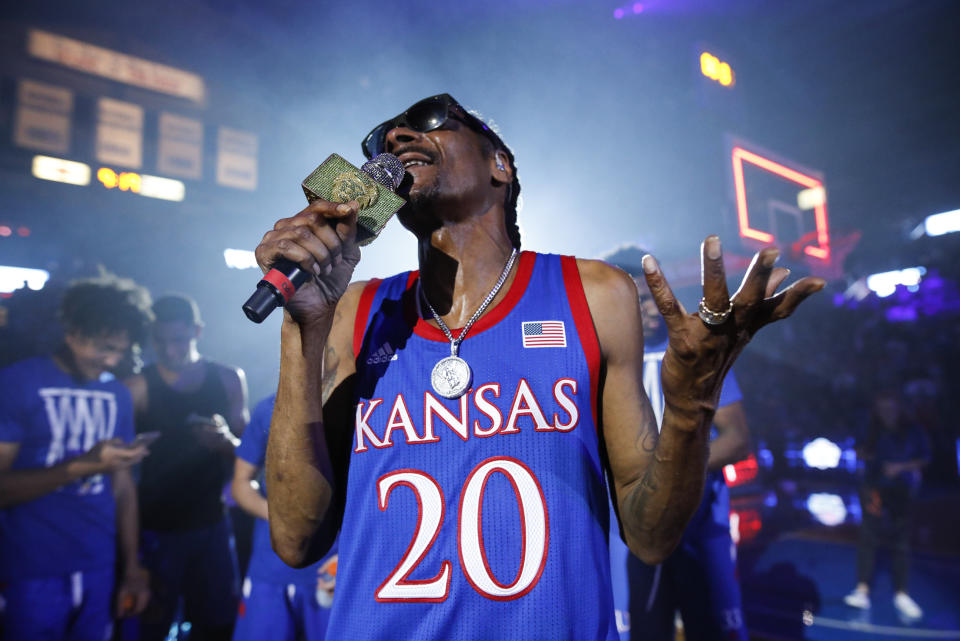 In this Friday, Oct. 4, 2019 photo, rapper Snoop Dogg performs for the Allen Fieldhouse crowd during Late Night in the Phog, Kansas' annual NCAA college basketball kickoff at Allen Fieldhouse in Lawrence, Kan. (Nick Krug/The Lawrence Journal-World via AP)