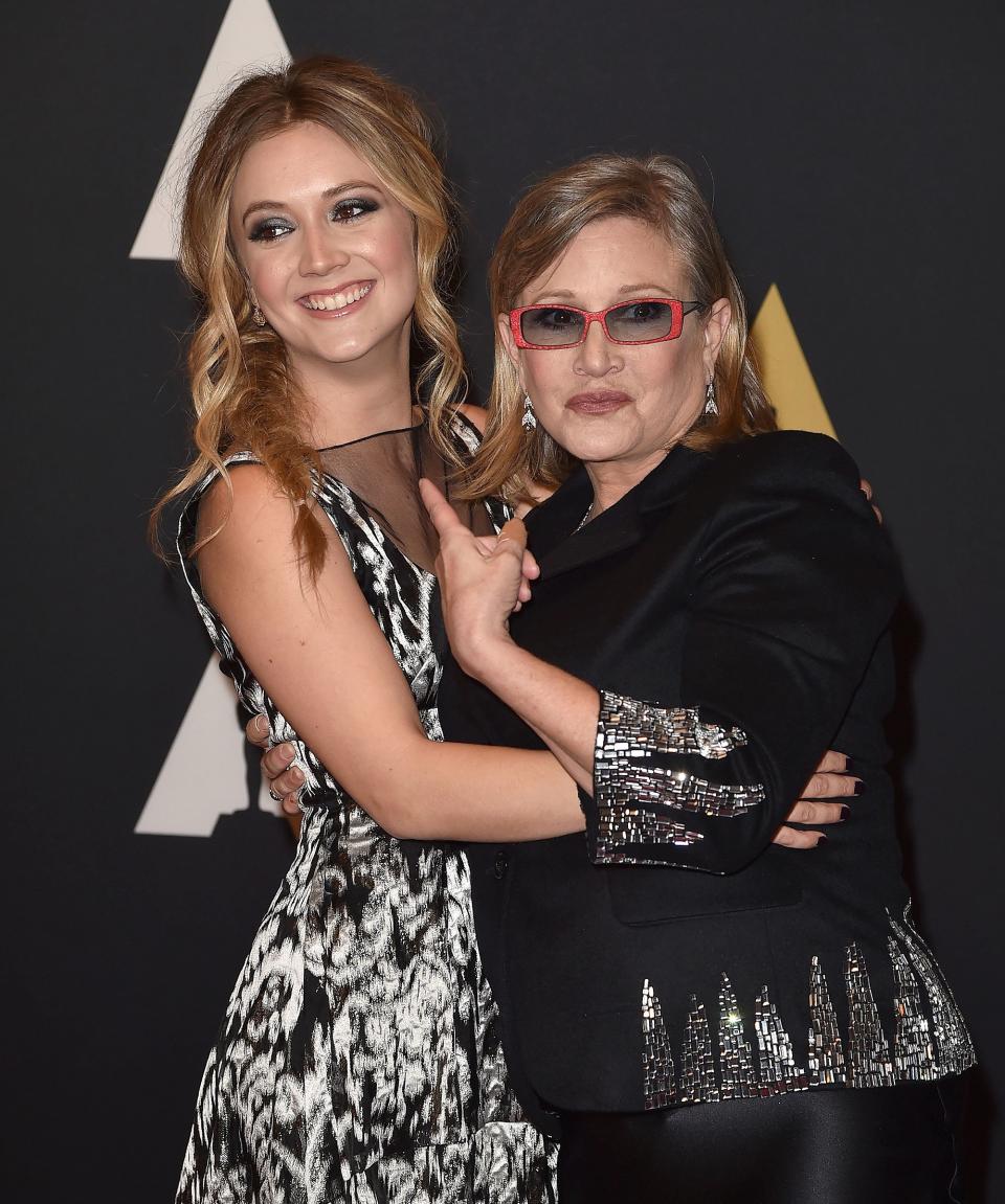 Lourd and Fisher share an embrace on the red carpet while attending the 2015 Governors Awards.