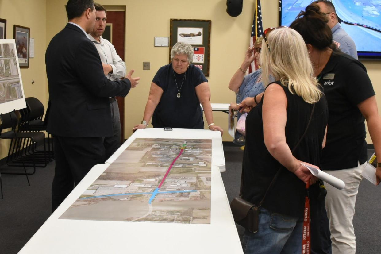 Members of the public and Ohio Department of Transportation officials look over plans for a set of two roundabouts on Ohio 2 and Ohio 53 planned to be constructed in the next two years.