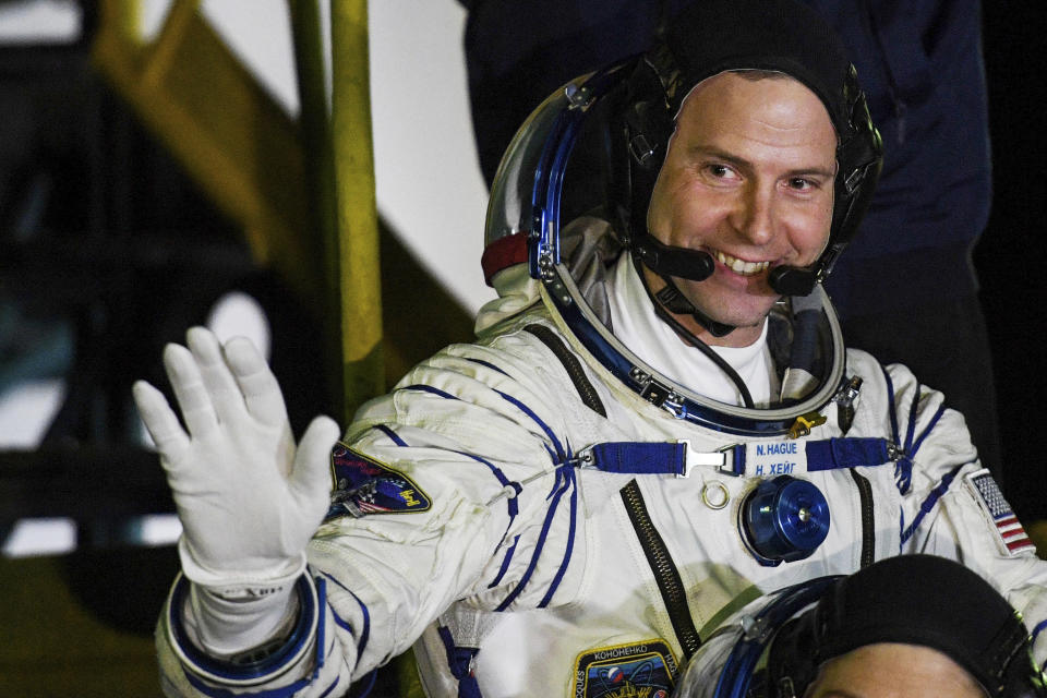 U.S. astronaut Nick Hague, crew members of the mission to the International Space Station, ISS, waves near the rocket prior the launch of Soyuz-FG rocket at the Russian leased Baikonur cosmodrome, Kazakhstan, Thursday, March 14, 2019. (AP Photo/Kyrill Kudryavtsev, Pool)