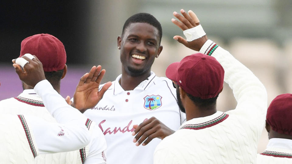 Seen here, Windies captain Jason Holder celebrates one of his six wickets against England.