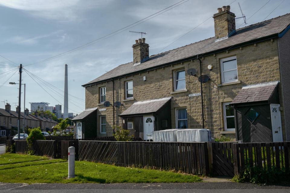 HUDDERSFIELD, ENGLAND - MAY 13: A factory is seen beyond houses on a residential estate close to the John Smith's Stadium ahead of the Brexit Party rally on May 13, 2019 in Huddersfield, England. Nigel Farage, the former leader of the U.K. Independence Party, is campaigning for the Brexit Party's contest for this month's European Parliament elections, whose candidates include Annunziata Rees-Mogg. Despite voting to leave the European Union in 2016 Britain is braced to take part in the European Parliament election on May 23. (Photo by Anthony Devlin/Getty Images)