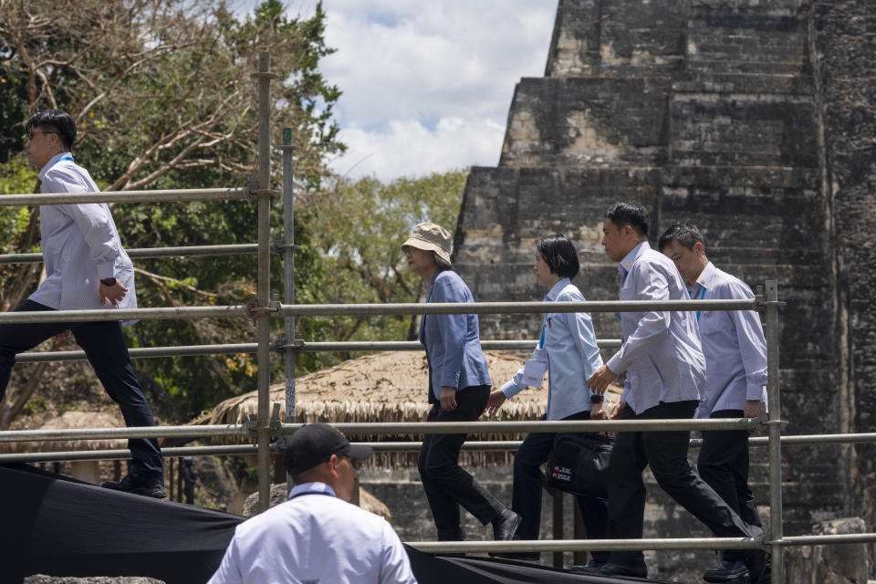 Taiwan's President Tsai Ing-wen, center left, visits the Mayan site Tikal, in Peten, Guatemala, Saturday, April 1, 2023. Tsai is in Guatemala for an official three-day visit. (AP Photo/Moises Castillo)