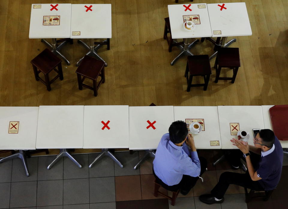 Diners keep their social distance at a cafe during the coronavirus disease outbreak in Singapore September 7, 2021. Source: REUTERS via AAP