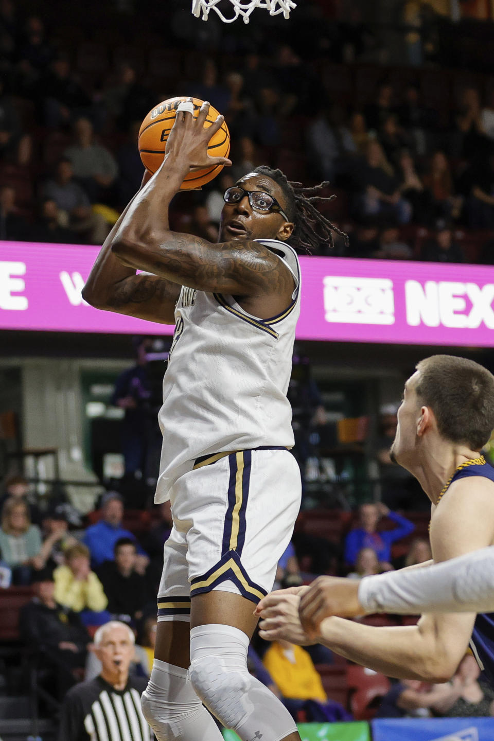 Montana State forward Jubrile Belo (13) pulls down a rebound against Northern Arizona in the first half of an NCAA college basketball game for the championship of the Big Sky men's tournament in Boise, Idaho, Wednesday, March 8, 2023. (AP Photo/Steve Conner)