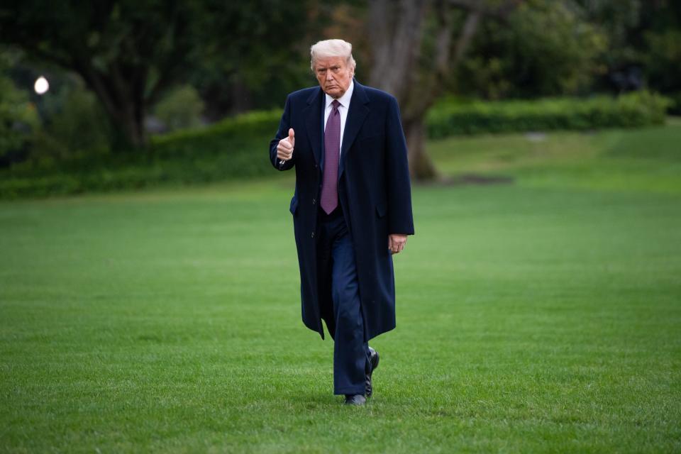 US President Donald Trump walks from Marine One after arriving on the South Lawn of the White House in Washington, DC, October 1, 2020, following campaign events in New Jersey. - White House Chief of Staff Mark Meadows said on October 1, 2020, that he was optimistic about a rapid recovery for the president as he confirmed that Trump has "mild symptoms" after testing positive for Covid-19. "The president and the First Lady... remain in good spirits," Meadows told reporters. (Photo by SAUL LOEB / AFP) (Photo by SAUL LOEB/AFP via Getty Images)