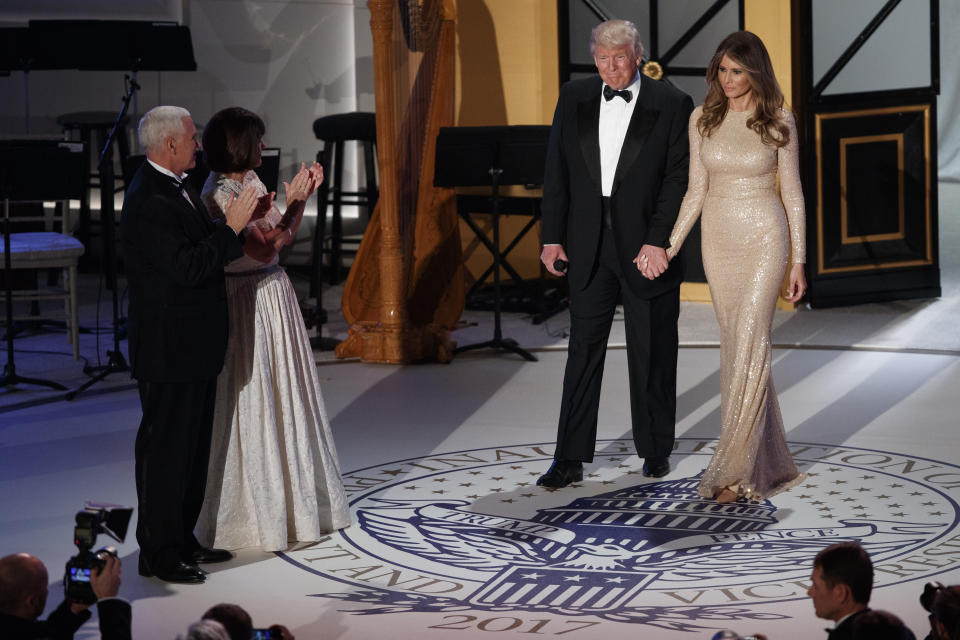 <p> Vice President-elect Mike Pence, left, and his wife Karen, second from left, applaud as President-elect Donald Trump and his wife Melania arrive for a VIP reception and dinner with donors, Thursday, Jan. 19, 2017, in Washington. (AP Photo/Evan Vucci) </p>