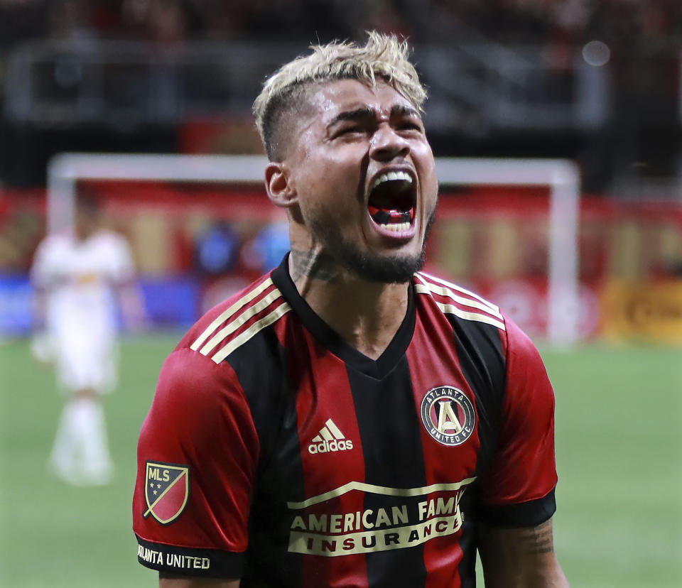 El delantero venezolano Josef Martínez del Atlanta United grita un gol durante el partido ante los Red Bulls de Nueva York por los playoffs de la MLS, el domingo 25 de noviembre de 2018. (Curtis Compton/Atlanta Journal-Constitution via AP)