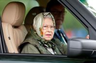 <p>Once again attending the Royal Windsor Horse Show, the Queen entered the event while driving her Range Rover. Fittingly, she chose a headscarf with a horse print. </p>
