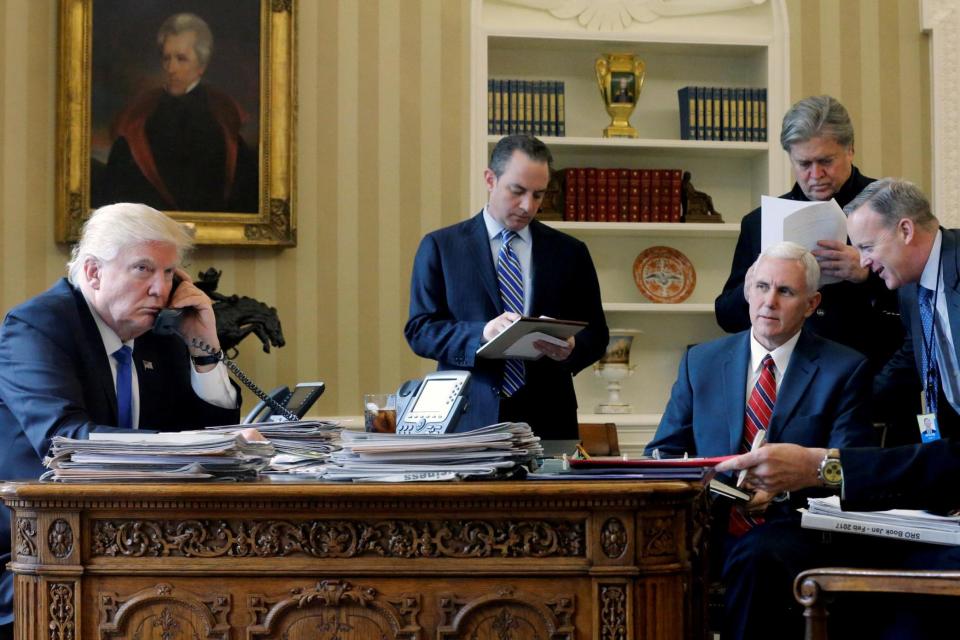 Donald Trump with Mr Bannon and other advisers in the early days of his presidency (REUTERS)