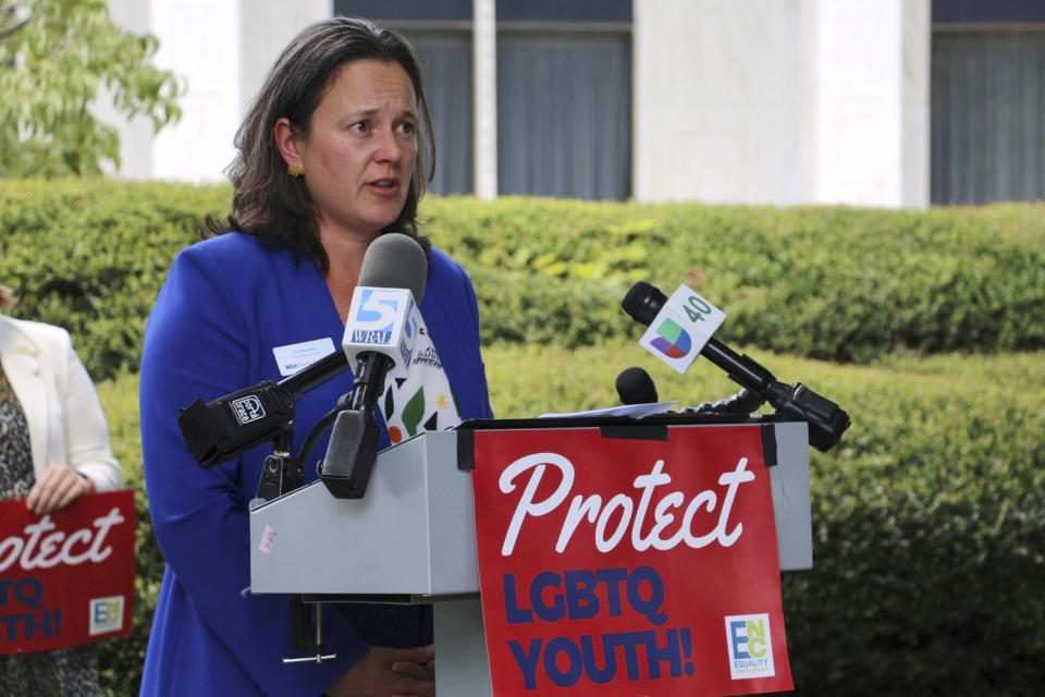 Liz Barber, of the American Civil Liberties Union of North Carolina, speaks at a news conference, Wednesday, Aug. 16, 2023, outside the Legislative Building in Raleigh, N.C. The state legislature's Republican supermajority will attempt later Wednesday to override the Democratic governor's veto of a gender-affirming care ban for minors. (AP Photo/Hannah Schoenbaum)