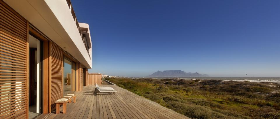 Big Bay Beach House is a five-bedroom, three-bath getaway set 30 minutes outside Cape Town, South Africa. Fuchs Wacker Architekten devised a modern home that utilizes passive design principles and takes advantage of the site’s views of Robben Island and Table Mountain.
