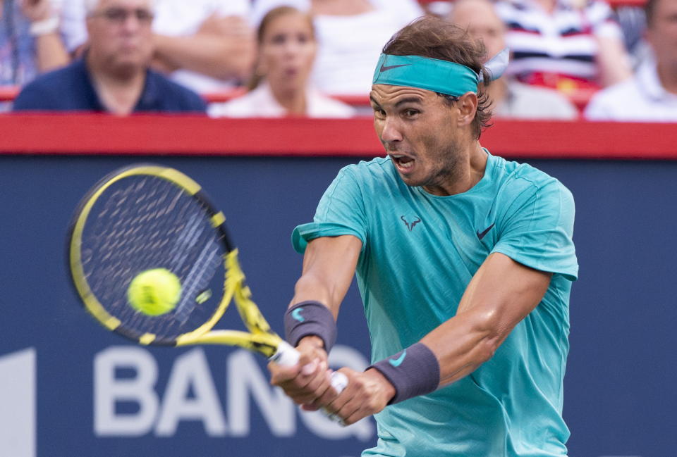Rafael Nadal, of Spain, returns to Guido Pella, of Argentina, during the Rogers Cup men’s tennis tournament Thursday, Aug. 8, 2019, in Montreal. (Paul Chiasson/The Canadian Press via AP)