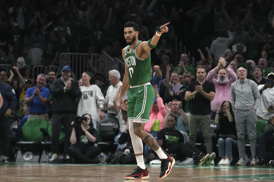 Boston Celtics forward Jayson Tatum (0) celebrates during the second half of Game 7 against the Philadelphia 76ers in the NBA basketball Eastern Conference semifinals playoff series, Sunday, May 14, 2023, in Boston. (AP Photo/Steven Senne)