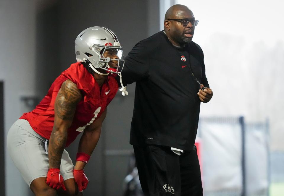 Mar 7, 2024; Columbus, OH, USA; Ohio State Buckeyes running backs coach Tony Alford works with Quinshon Judkins (1) during spring football practice at the Woody Hayes Athletic Center.