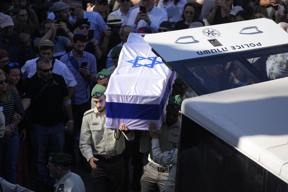 Border police officers carry the flagged draped coffin of border Police Sgt. Elisheva Rose Ida Lubin, 20, during her funeral in the Mount Herzl Military Cemetery in Jerusalem, Thursday, Nov. 9, 2023. Lubin succumbed late Monday to her wounds after she was stabbed by a Palestinian attacker in Jerusalem. (AP Photo/Ohad Zwigenberg)