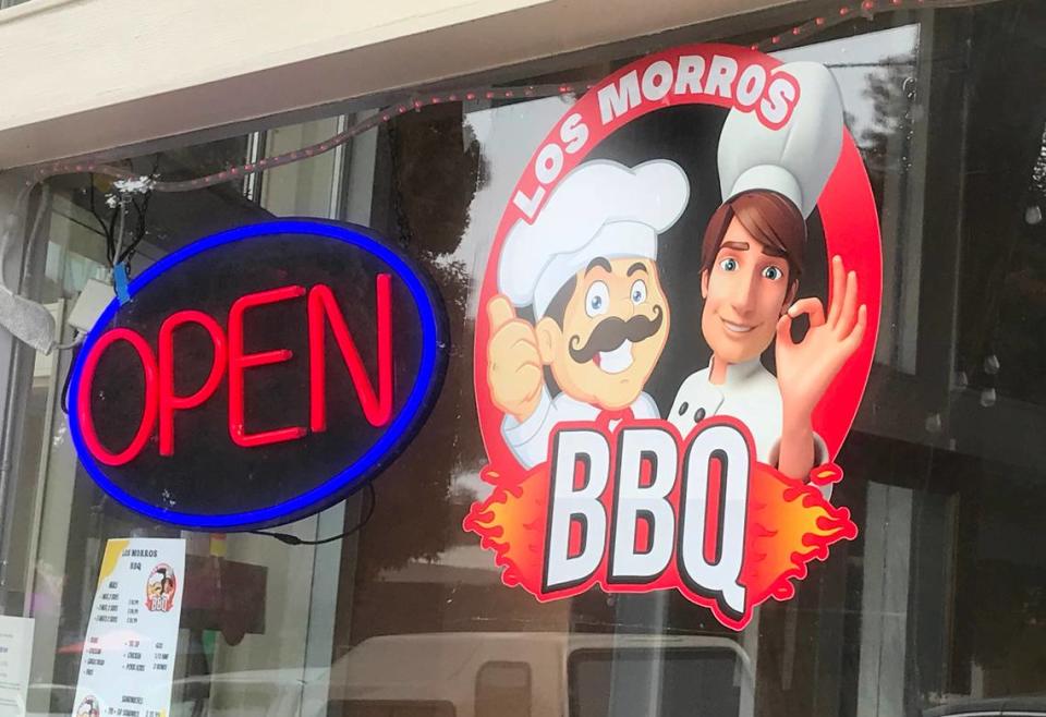 Hungry Morro Bay residents and ‘cue fans waited a long time for this “open” sign to appear at Los Morros BBQ, replacing a “coming soon” that had been in the window for about a year.