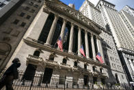 A pedestrian walks past the New York Stock Exchange, Monday, Jan. 24, 2022, in New York. Stocks have fallen sharply so far this year as the market readies for the Federal Reserve to raise interest rates to try to tame inflation, which is at its highest level in nearly four decades. (AP Photo/John Minchillo)