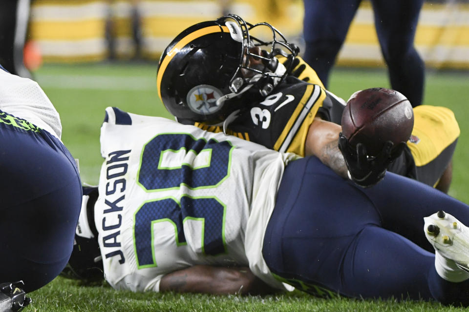 Pittsburgh Steelers running back Jaylen Warren, top, stretches the ball over Seattle Seahawks cornerback Mike Jackson (30) for a touchdown after making a catch during the second half of an NFL preseason football game Saturday, Aug. 13, 2022, in Pittsburgh. (AP Photo/Barry Reeger)