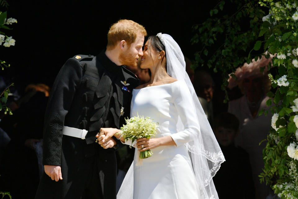 Harry and Meghan share their first kiss as a married couple. [Photo: PA]