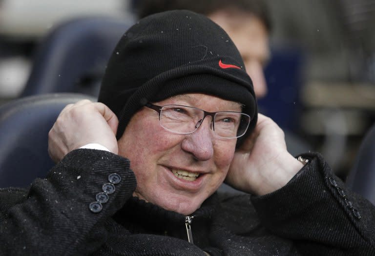 Manchester United manager Alex Ferguson wraps up ahead of the game against Tottenham Hotspur on January 20, 2013. As well as a two-legged tie with Madrid in the Champions League last 16, United are also scheduled to face Reading in the FA Cup, but Ferguson is happy with the depth in his squad