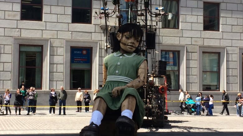 Marionettes as tall as houses march along Montreal streets during 375th birthday bash