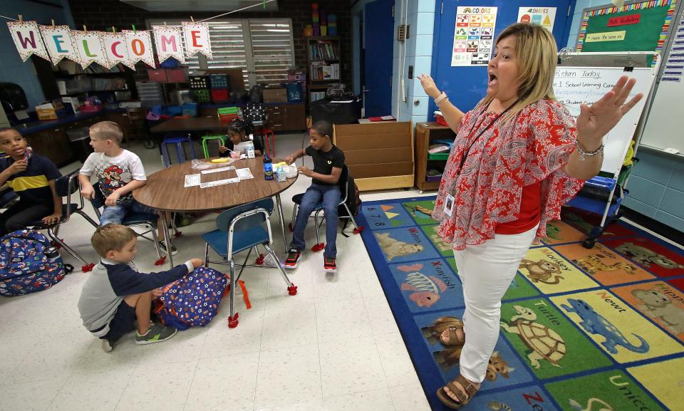 Reba Walker talks to her first graders during the first day of school early Wednesday morning, August 17, 2022, at Lowell Elementary School.