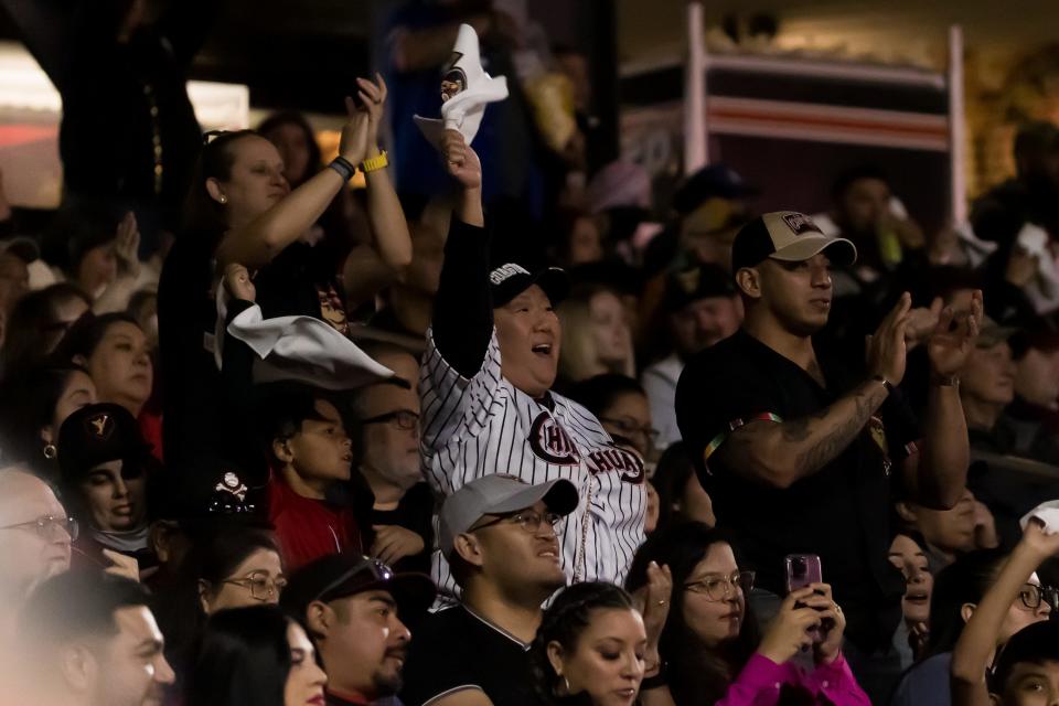 El Paso Chihuahuas fans celebrate at the season opener against the Sugar Land Space Cowboys Friday, March 31, 2023, at Southwest University Park in El Paso, Texas.