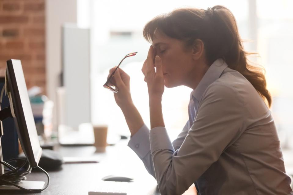 According to an international poll, over half of IT workers feel overwhelmed by the amount of work they have to do. Shutterstock