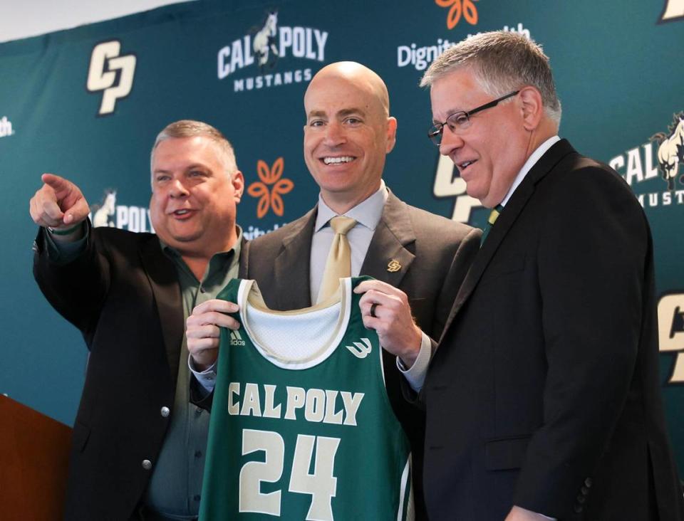 Mike DeGeorge, center, was introduced as Cal Poly’s new mens basketball head coach. He is flanked by athletics director Don Obherhelman, left, and President Jeffrey Armstrong.