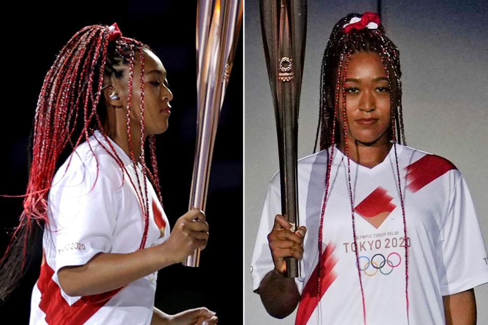 Japan's Naomi Osaka holds the Olympic torch