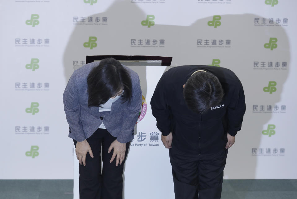 Taiwan President Tsai Ing-wen bows after she announcing her resignation as party chairwoman of Democratic Progressive Party in Taipei, Taiwan, Saturday, Nov. 26, 2022. Voters in Taiwan overwhelmingly chose the opposition Nationalist party in several major races across the self-ruled island in an election Saturday in which lingering concerns about threats from China took a backseat to more local issues. (AP Photo/Chiang Ying-ying)