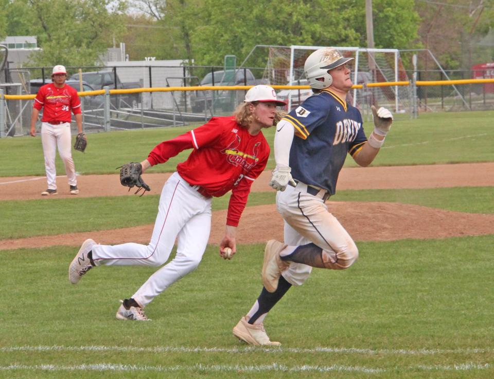 Coldwater's Nate Tappenden makes a play off the mound versus DeWitt during the 2021 season.