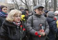People gather to attend a memorial service before the funeral of Russian leading opposition figure Boris Nemtsov in Moscow, March 3, 2015. REUTERS/Maxim Shemetov