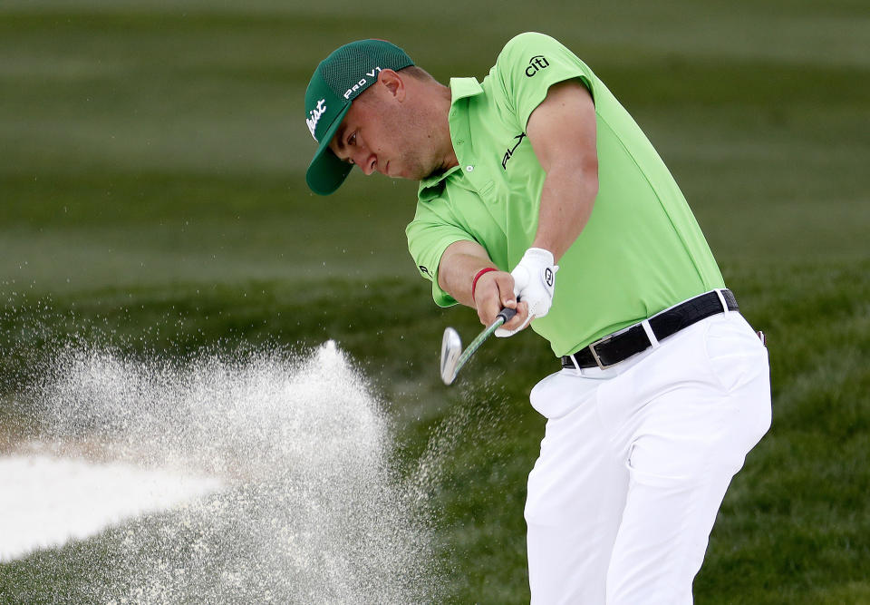 Justin Thomas hits from the sixth fairway bunker during the third round of the Phoenix Open PGA golf tournament, Saturday, Feb. 2, 2019, in Scottsdale, Ariz. (AP Photo/Matt York)