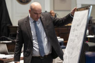 Prosecutor John Conrad reviews a timeline made by defense attorney Phillip Barber of events on Maggie Murdaugh's cell phone during Alex Murdaugh's trial for murder at the Colleton County Courthouse in Walterboro, S.C., on Wednesday, Feb. 1, 2023. (Joshua Boucher/The State via AP, Pool)