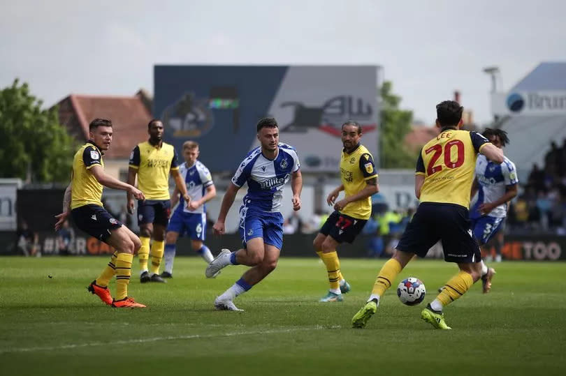 Footballers playing a league match