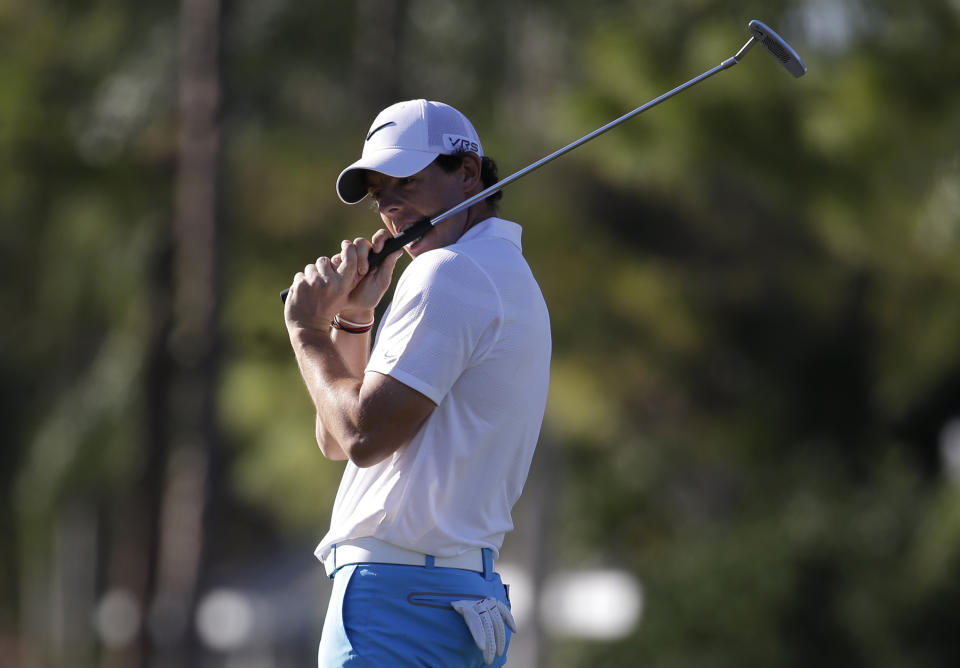 Rory McIlroy of Northern Ireland bites his golf club after missing a birdie putt on the 13th hole during the third round of the Honda Classic golf tournament, Saturday, March 1, 2014, in Palm Beach Gardens, Fla. (AP Photo/Lynne Sladky)