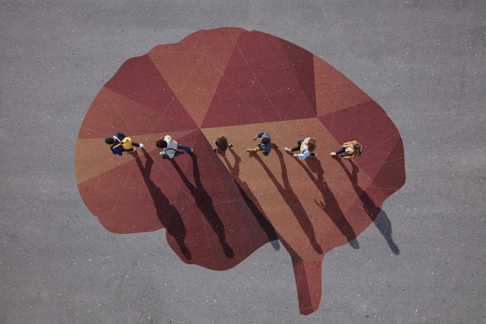 Group of young adults, photographed from above, on various painted tarmac surface, at sunrise. Photo: Getty